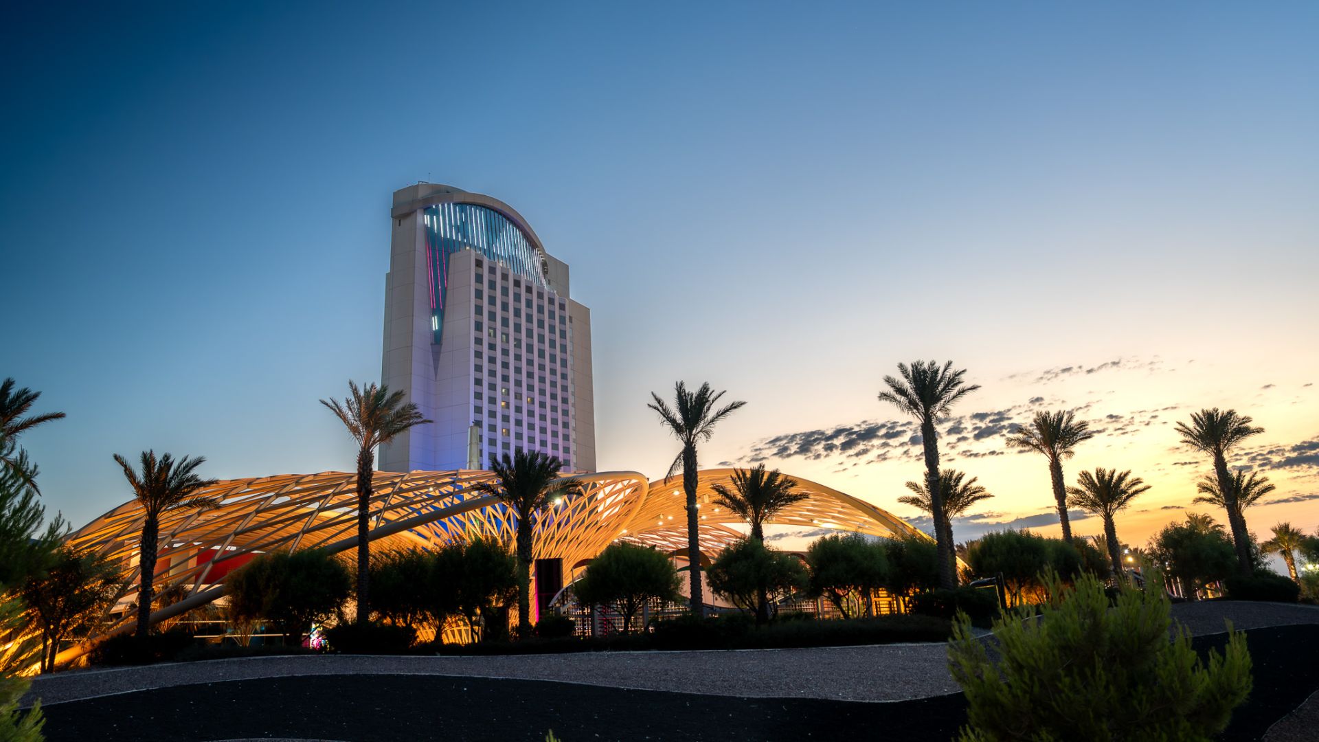 A Tall Building With A Glass Front