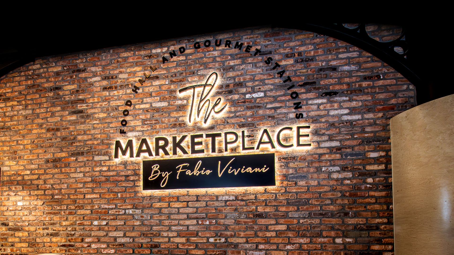 A Sign On A Brick Wall